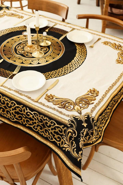 Baroque tapestry tablecloth with gold medallion used for elegant table setting.