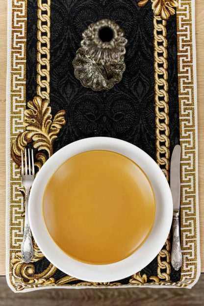 Black and gold baroque table runner styled with a cup of tea on a wooden table