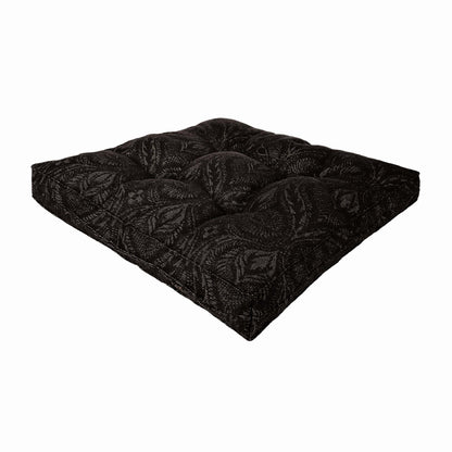 Black baroque chair pad with quilted surface, isolated on white background