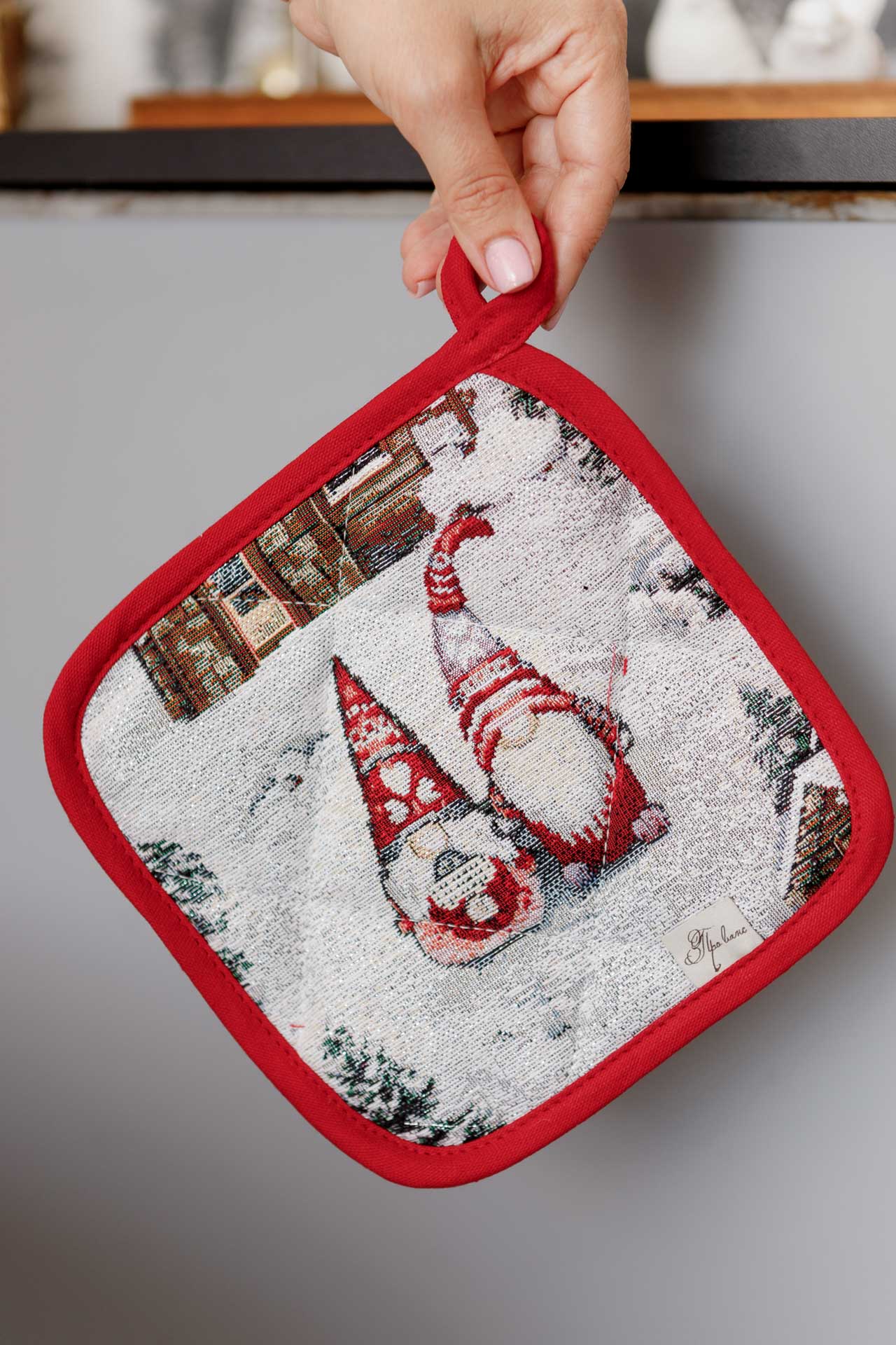 Christmas gnome tapestry pot holder held by hand