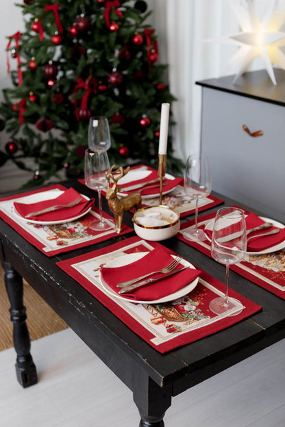 Christmas table place setting with festive tapestry napkins