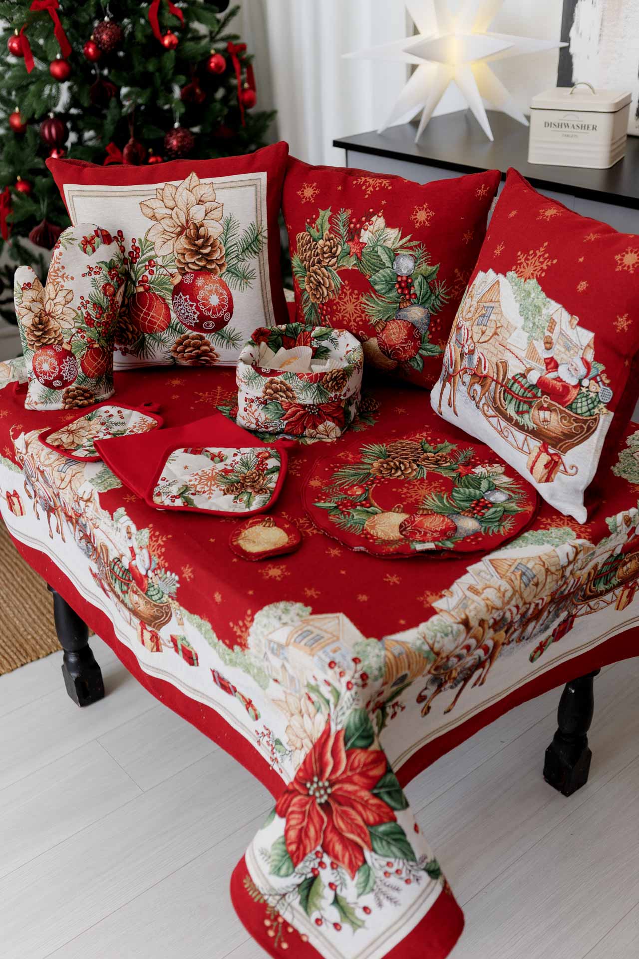 Christmas tapestry pillowcase with poinsettias, pinecones, and holiday ornaments — red festive cushion cover on a table