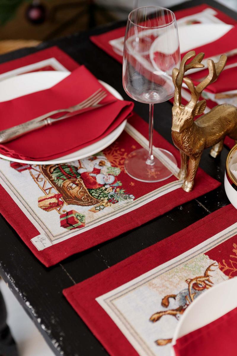 Close-up of Santa and reindeer embroidery on placemat