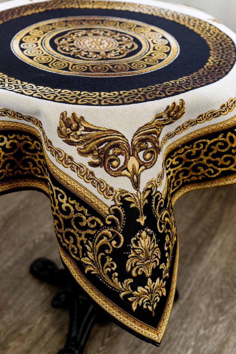 Close-up of baroque corner detailing on gold and black tapestry tablecloth.