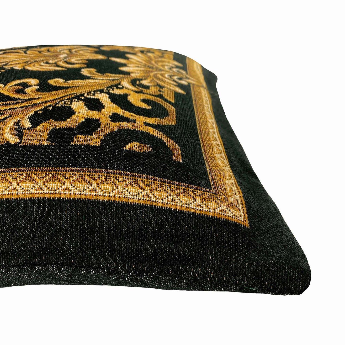 Close-up of black and gold baroque tapestry pillowcase showing detailed woven texture and gold scrollwork border