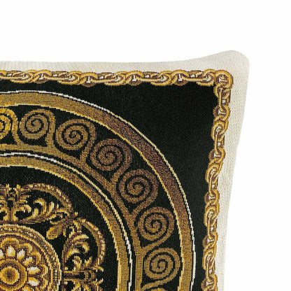 Close-up of the black baroque tapestry pillow showing detailed gold medallion and scrollwork pattern.