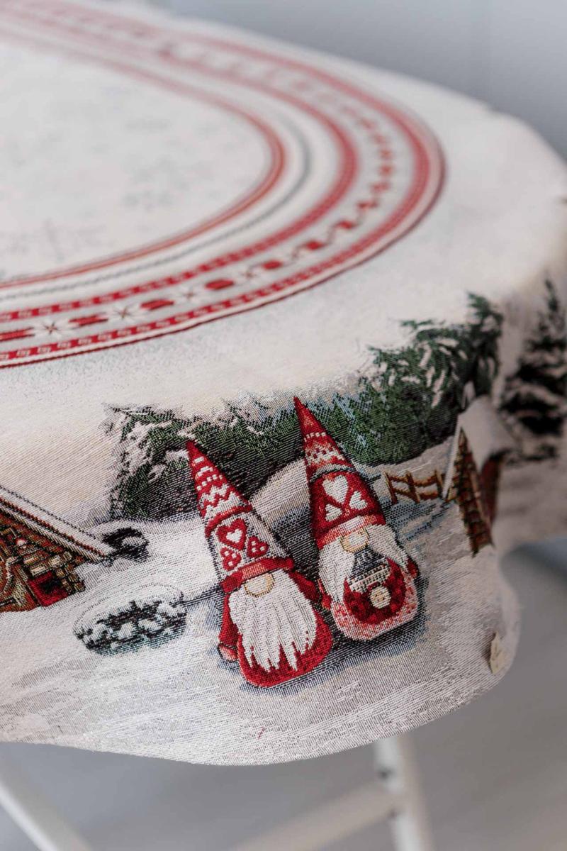 Close-up of woven Christmas gnomes on tapestry fabric for winter holiday table setting