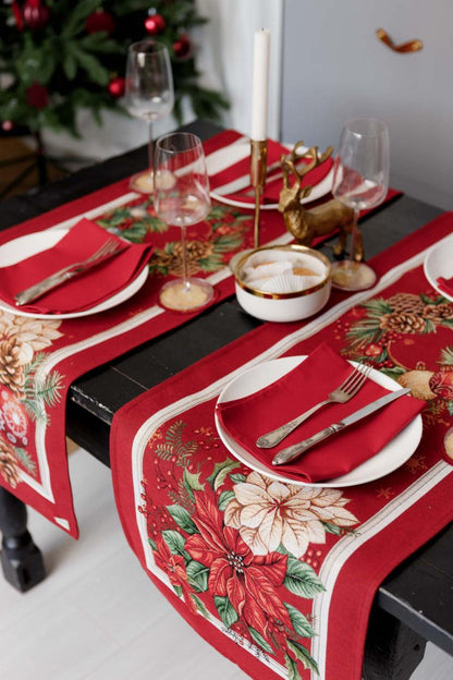 Close-up of woven tapestry fabric with poinsettia flowers, Christmas wreath, and gold ornaments.
