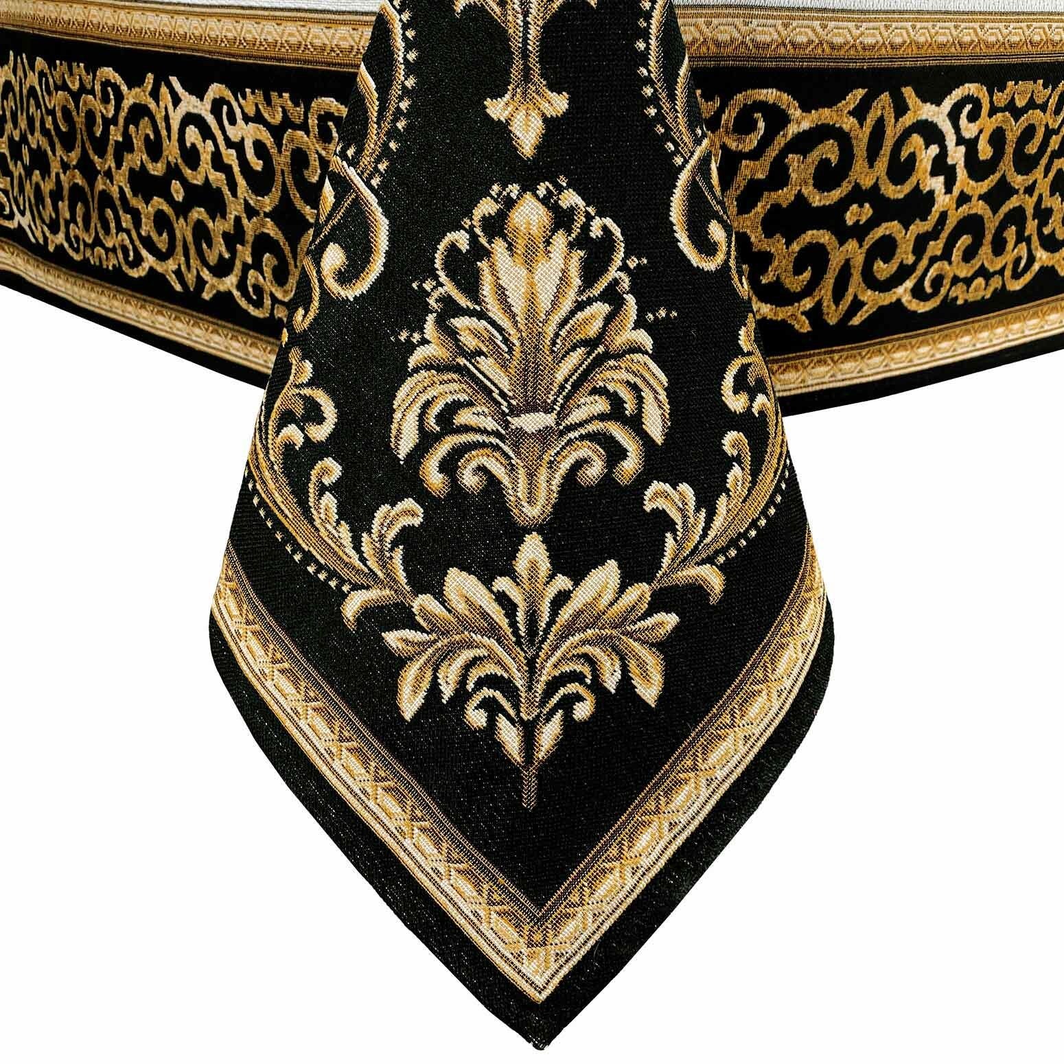 Decorative baroque corner motif with gold embroidery on black tapestry tablecloth.