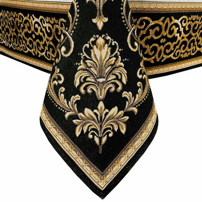 Decorative baroque corner motif with gold embroidery on black tapestry tablecloth.