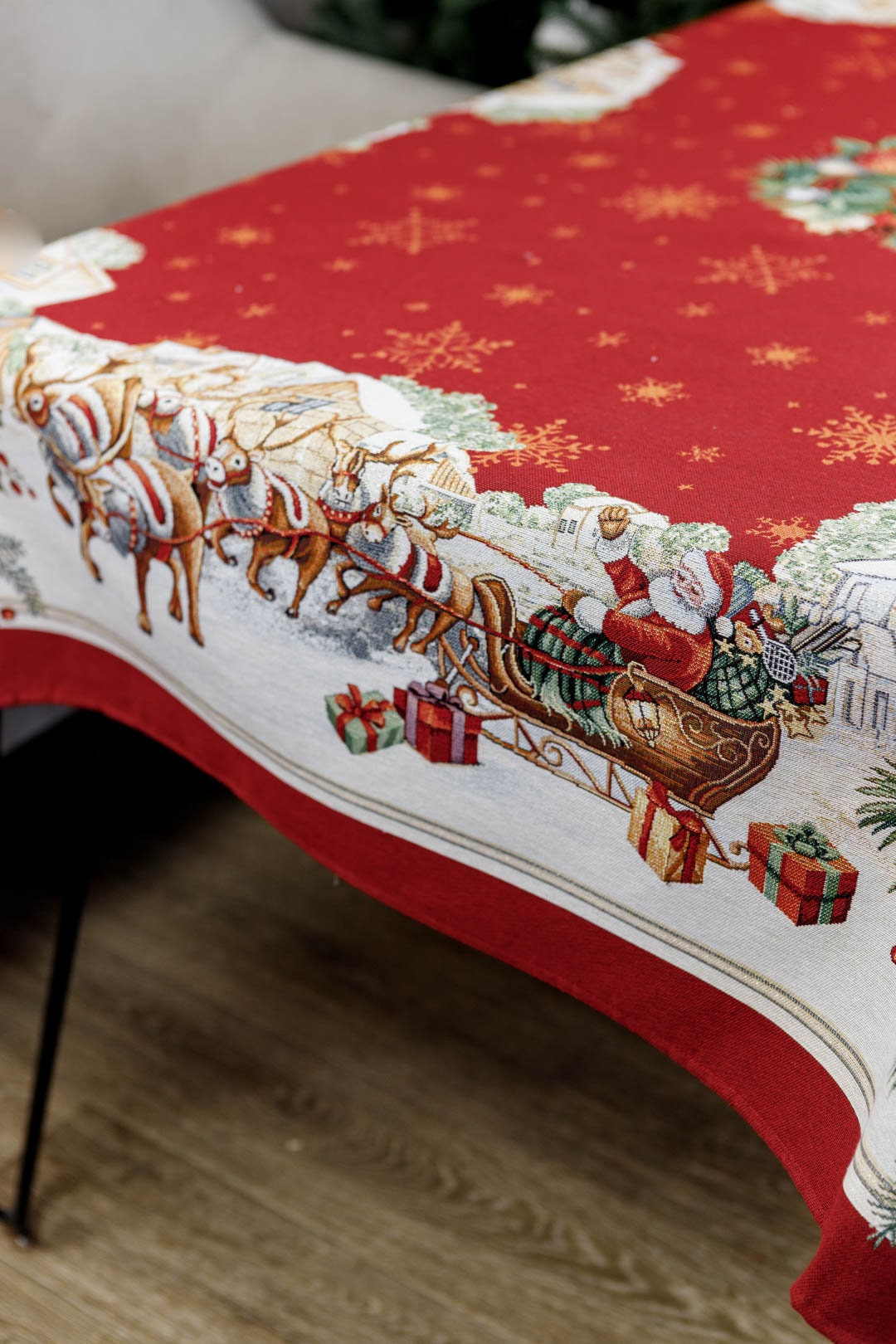 Detailed tapestry fabric pattern with Santa and reindeers, red Christmas textile
