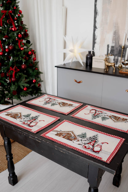 Detailed view of woven gnomes and snowy cottage design on Christmas tapestry placemat