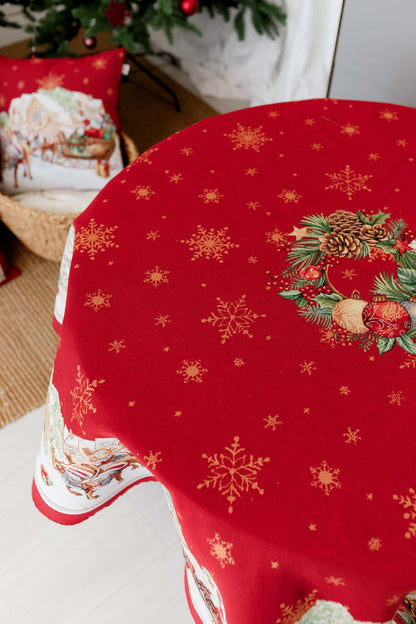 Dining table setup with round Santa sleigh Christmas tablecloth and holiday tableware