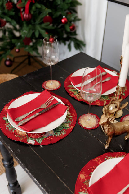 Elegant red Christmas placemats on wooden table with ornament embroidery