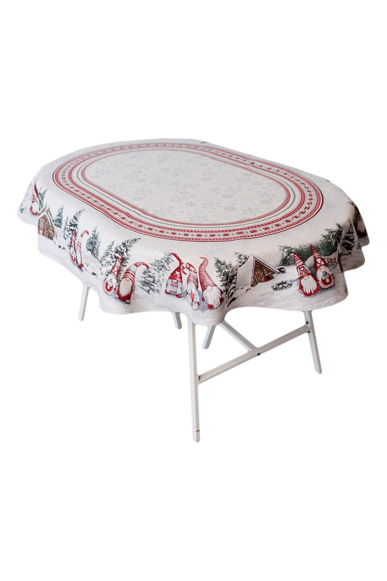 Festive oval Christmas tablecloth with gnomes on a holiday dining table, winter home decor