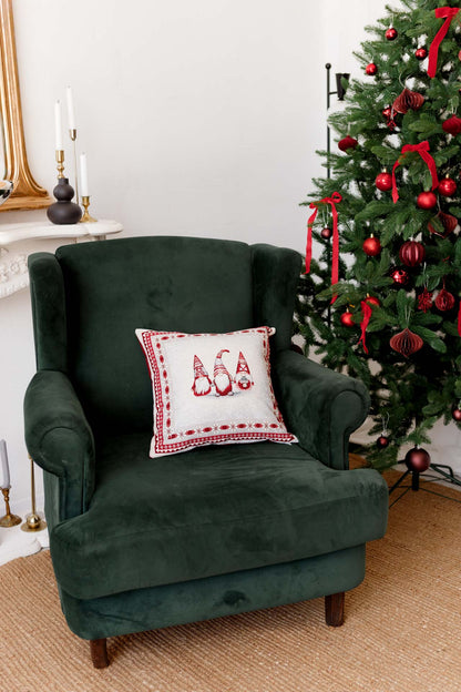 Festive red and white gnome pillowcase styled in a cozy holiday interior with Christmas decorations