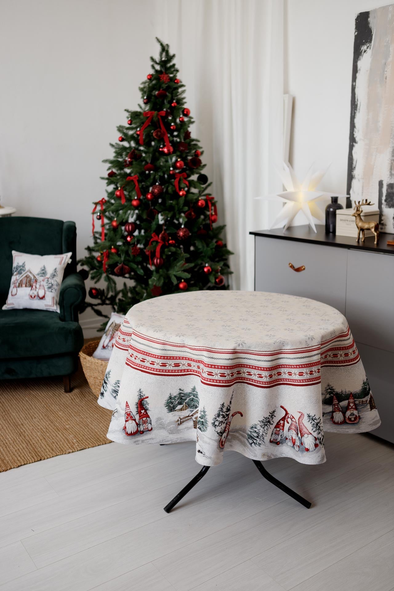 Festive round Christmas tablecloth displayed on table in holiday interior