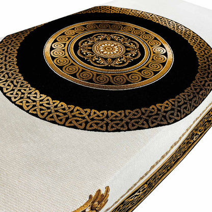 Gold and black medallion pattern on baroque tapestry tablecloth, detailed close-up.