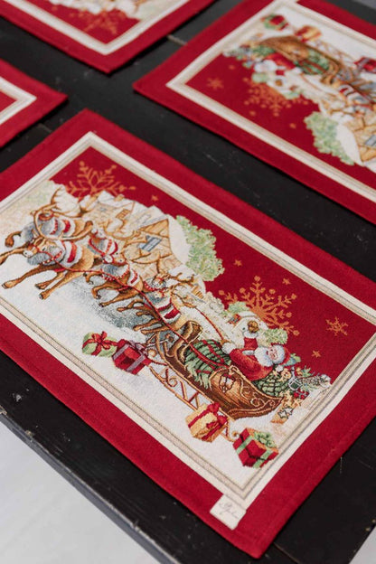 Holiday dining table setup with red Santa tapestry placemats