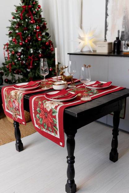 Holiday kitchen and dining decor styled with a red poinsettia tapestry table runner.