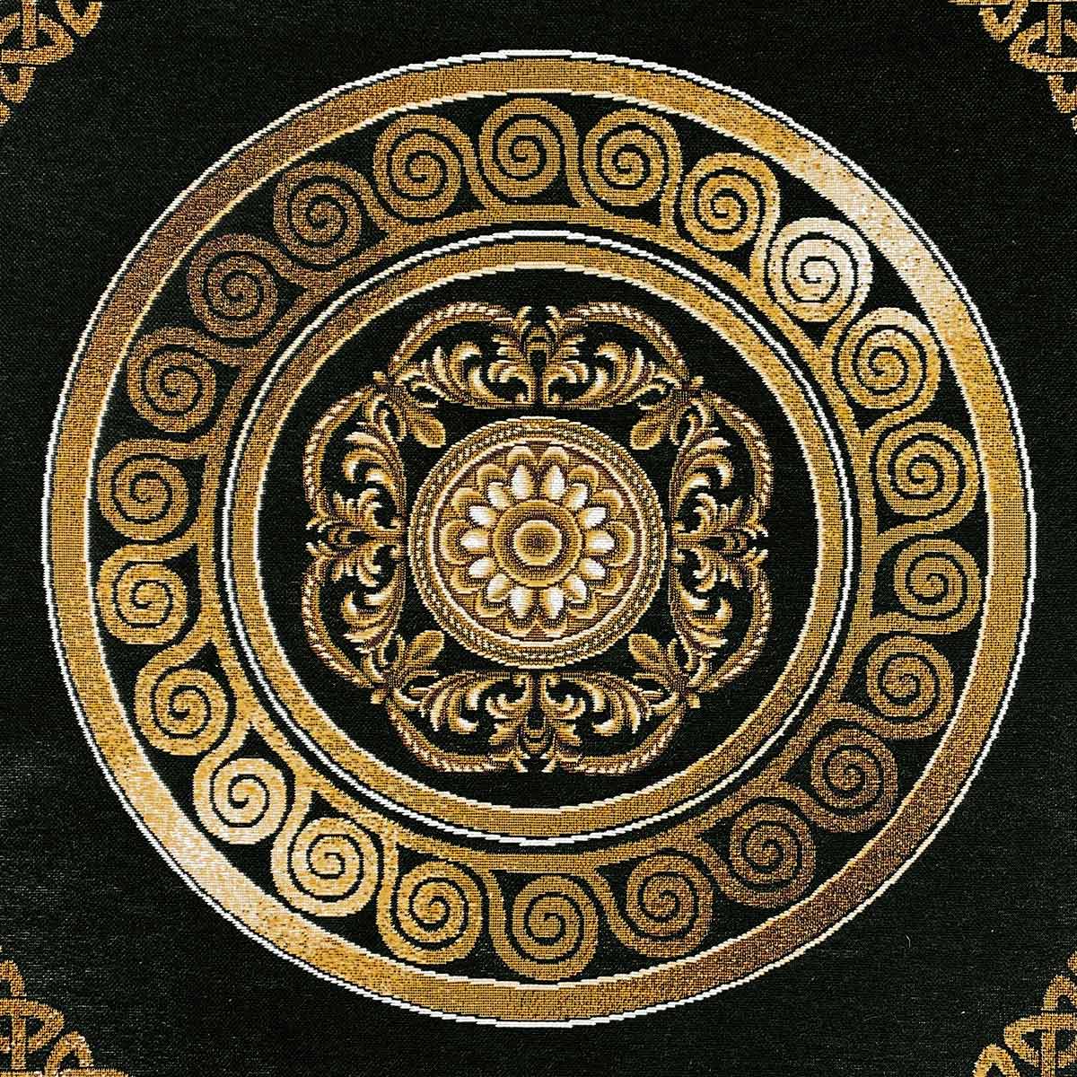Intricate gold circular emblem on black tapestry fabric, baroque tablecloth design.