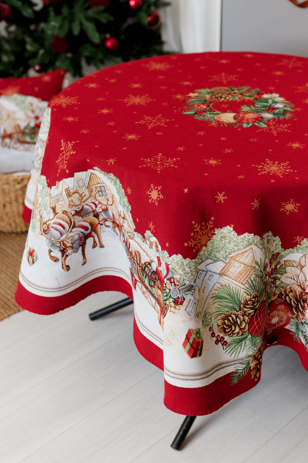 Luxury red round holiday tablecloth with Santa sleigh pattern and festive wreath decor