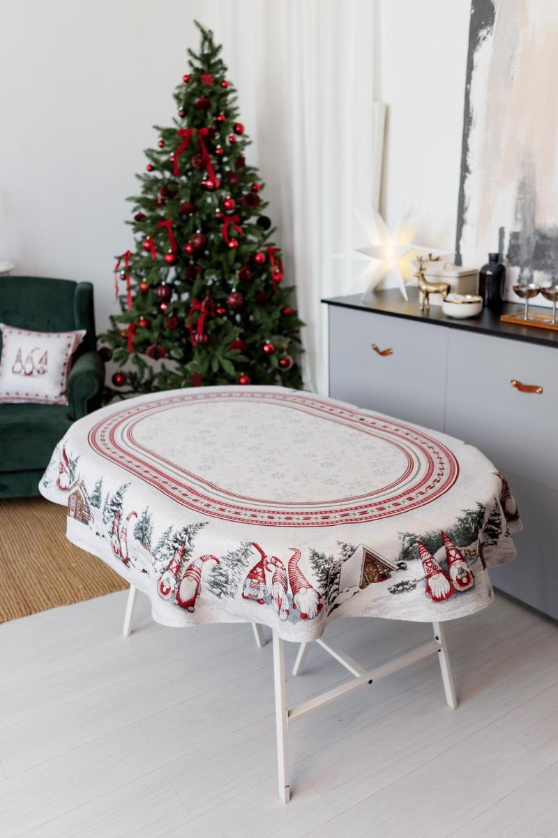 Oval Christmas tapestry tablecloth with gnomes and snowy cottage design, festive holiday dining decor