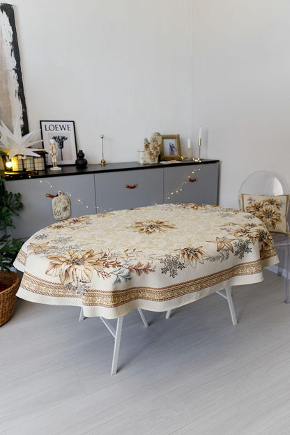 Oval woven tapestry tablecloth with Christmas poinsettia flower design. Beige and gold. Made in Ukraine.