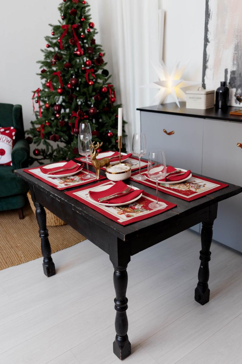 Red Santa sleigh placemats on dining table