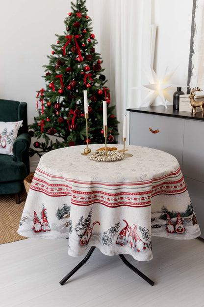 Round festive tablecloth styled with candles and gold decor