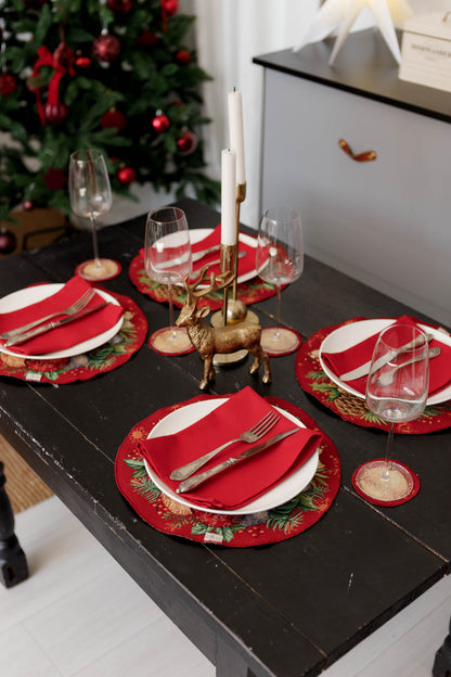 Round holiday placemats on dining table with festive decor and candles