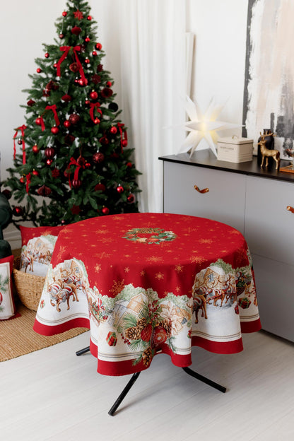 Round red tapestry Christmas tablecloth with Santa sleigh and wreath design on dining table