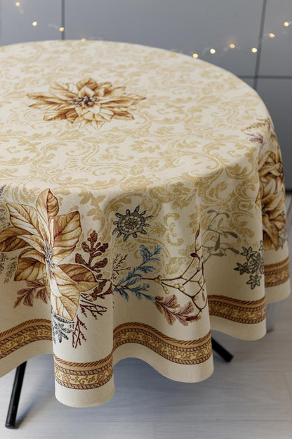 Round woven tapestry tablecloth with Christmas poinsettia flower design. Beige and gold. Made in Ukraine.
