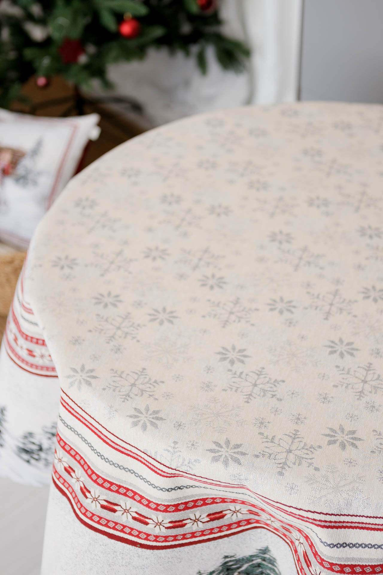 Snowflake pattern close-up on white jacquard Christmas tablecloth