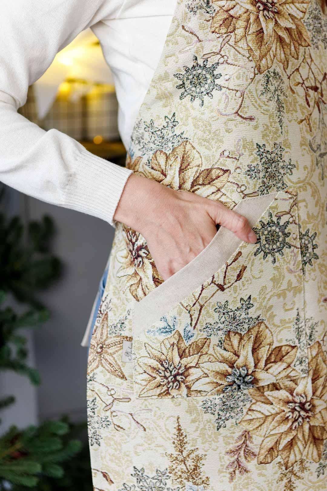 Tapestry Christmas kitchen apron with poinsettia floral design in beige and gold. Holiday cooking gift. Made in Ukraine.
