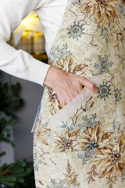 Tapestry Christmas kitchen apron with poinsettia floral design in beige and gold. Holiday cooking gift. Made in Ukraine.
