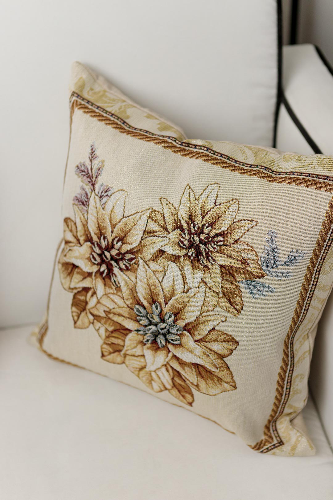 Tapestry pillowcase with Christmas poinsettia floral design. Beige and gold festive home decor. Made in Ukraine.
