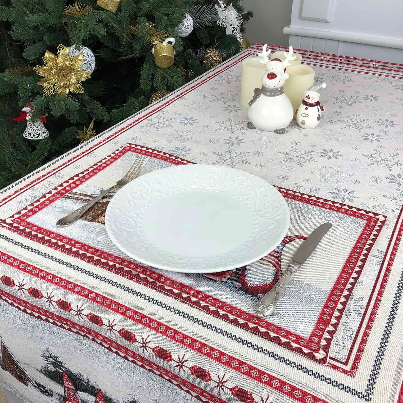 Top view of Christmas tapestry placemat with gnome design, plate, and silver cutlery on table