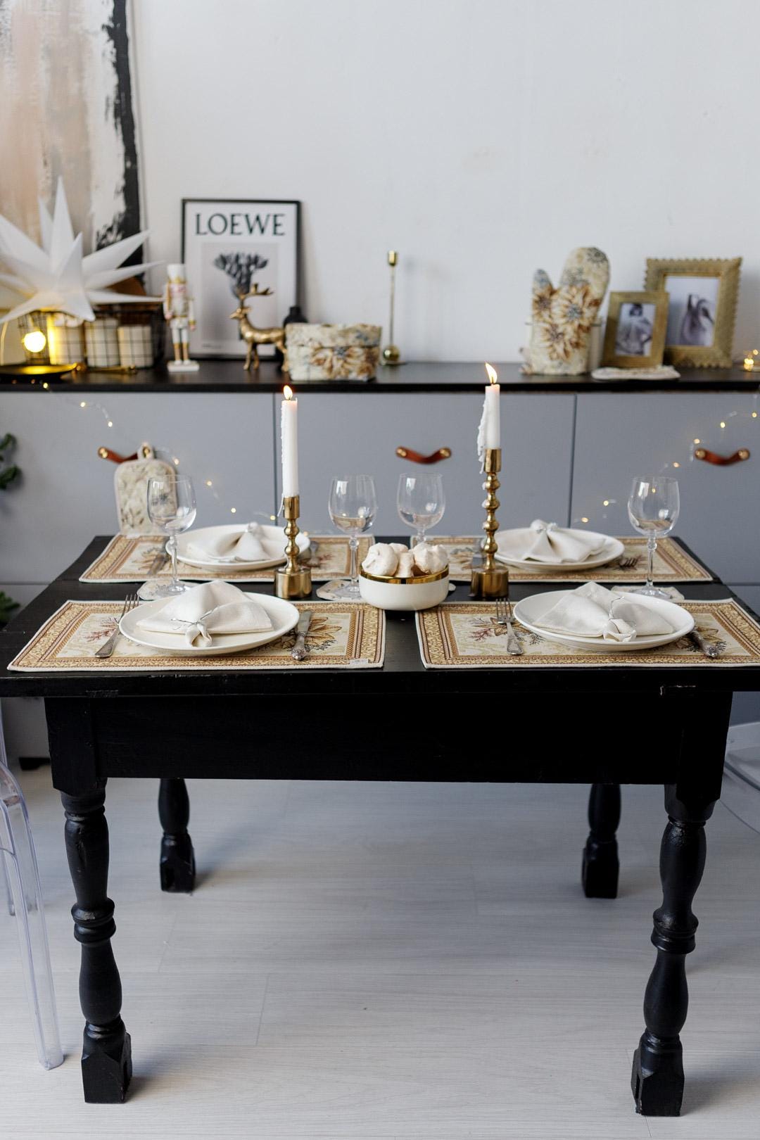 Woven tapestry placemat with Christmas poinsettia flower design. Beige and gold. Made in Ukraine.