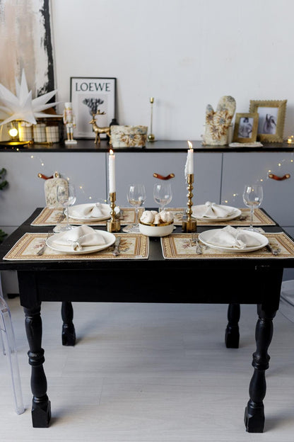 Woven tapestry placemat with Christmas poinsettia flower design. Beige and gold. Made in Ukraine.