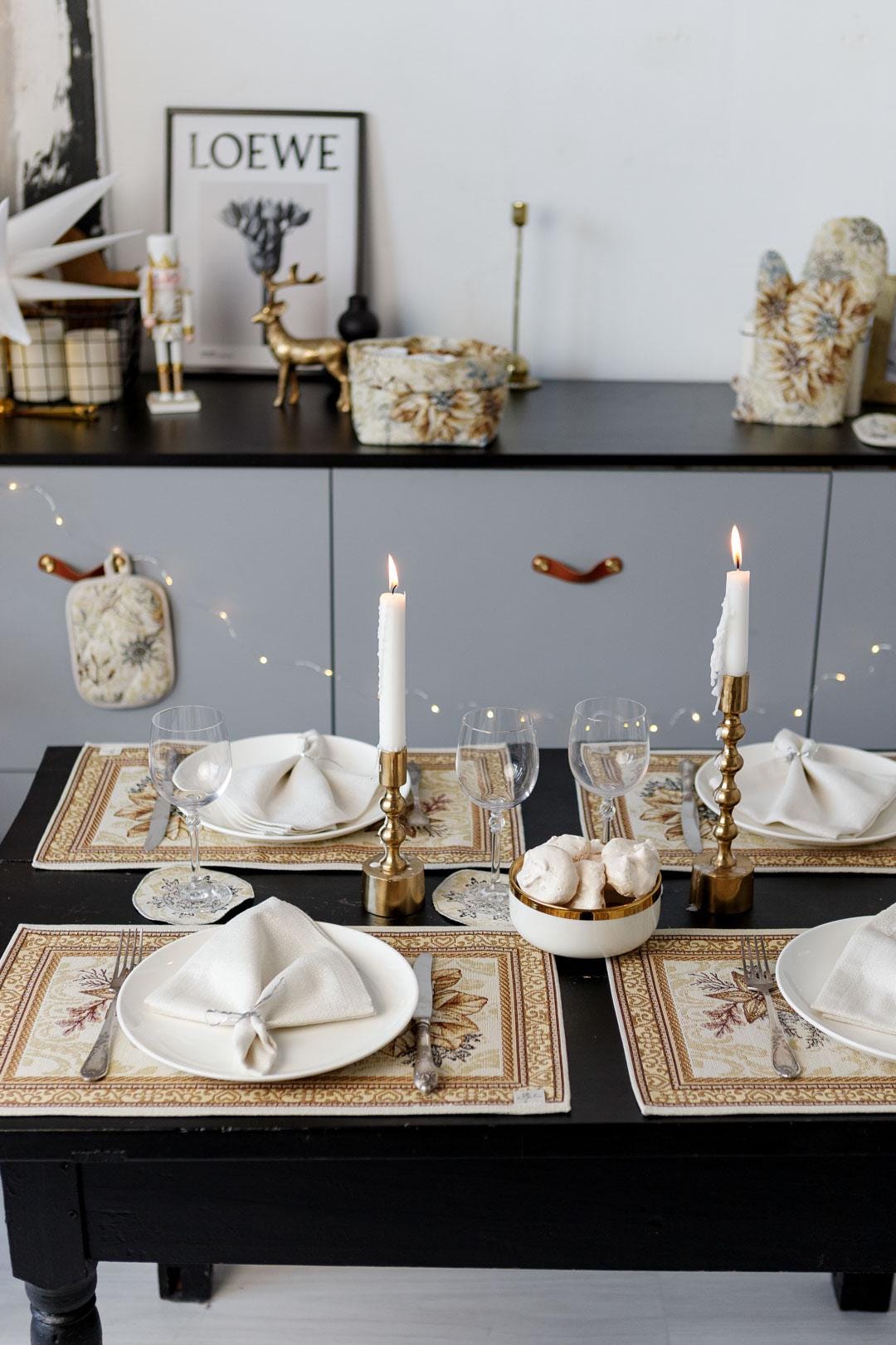 Woven tapestry placemat with Christmas poinsettia flower design. Beige and gold. Made in Ukraine.