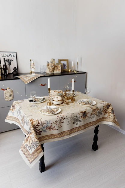 Woven tapestry tablecloth with Christmas poinsettia flower design. Beige and gold. Made in Ukraine.