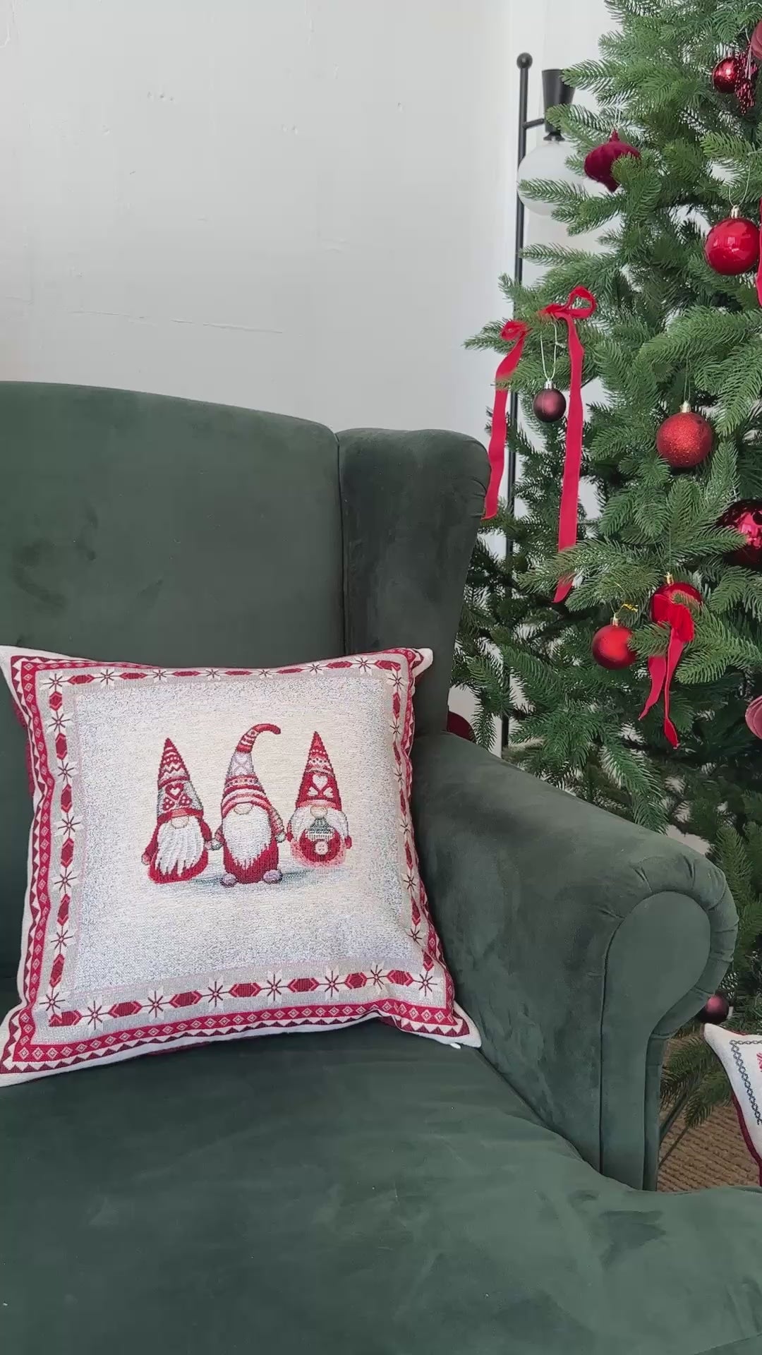 Video of Set of Christmas tapestry pillowcases with gnomes and cottage in cozy holiday interior.