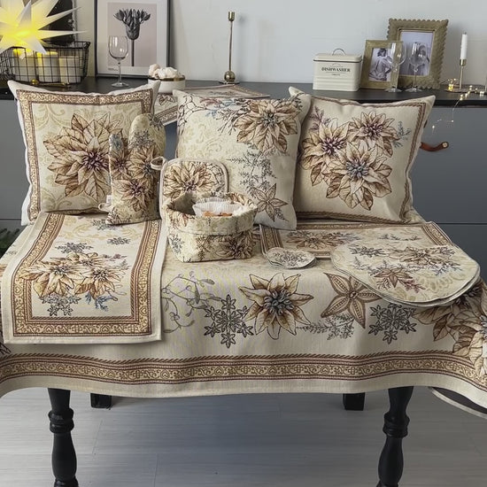 Woven tapestry tablecloth with Christmas poinsettia flower design. Beige and gold. Made in Ukraine.