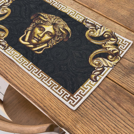 Video of Black and gold baroque tapestry placemat with Medusa head detail and ornate border